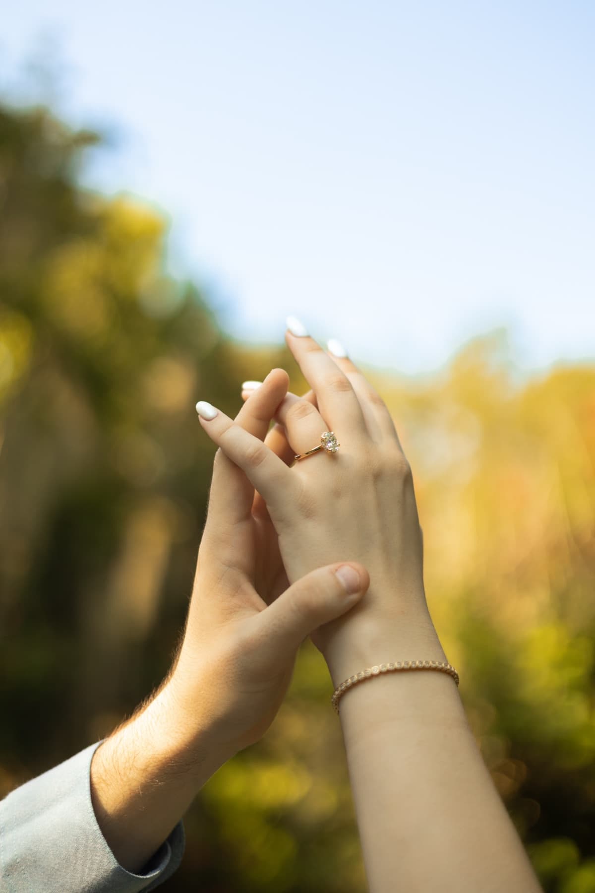 Hands raised with the ring